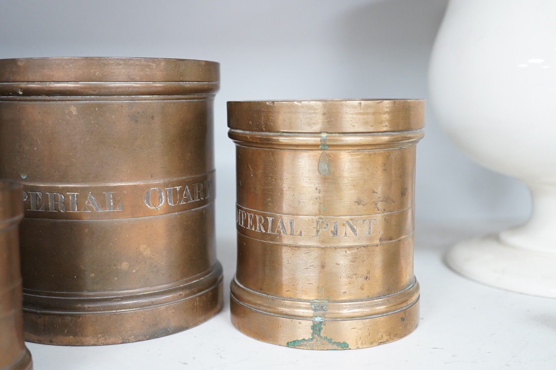 A set of seven early 20th century County of Fife official measures, comprising; a standard gallon, diameter 19.5cm, height 18.5cm, Imperial half gallon, Imperial quart, Imperial pint, Imperial half pint, Imperial gill, I